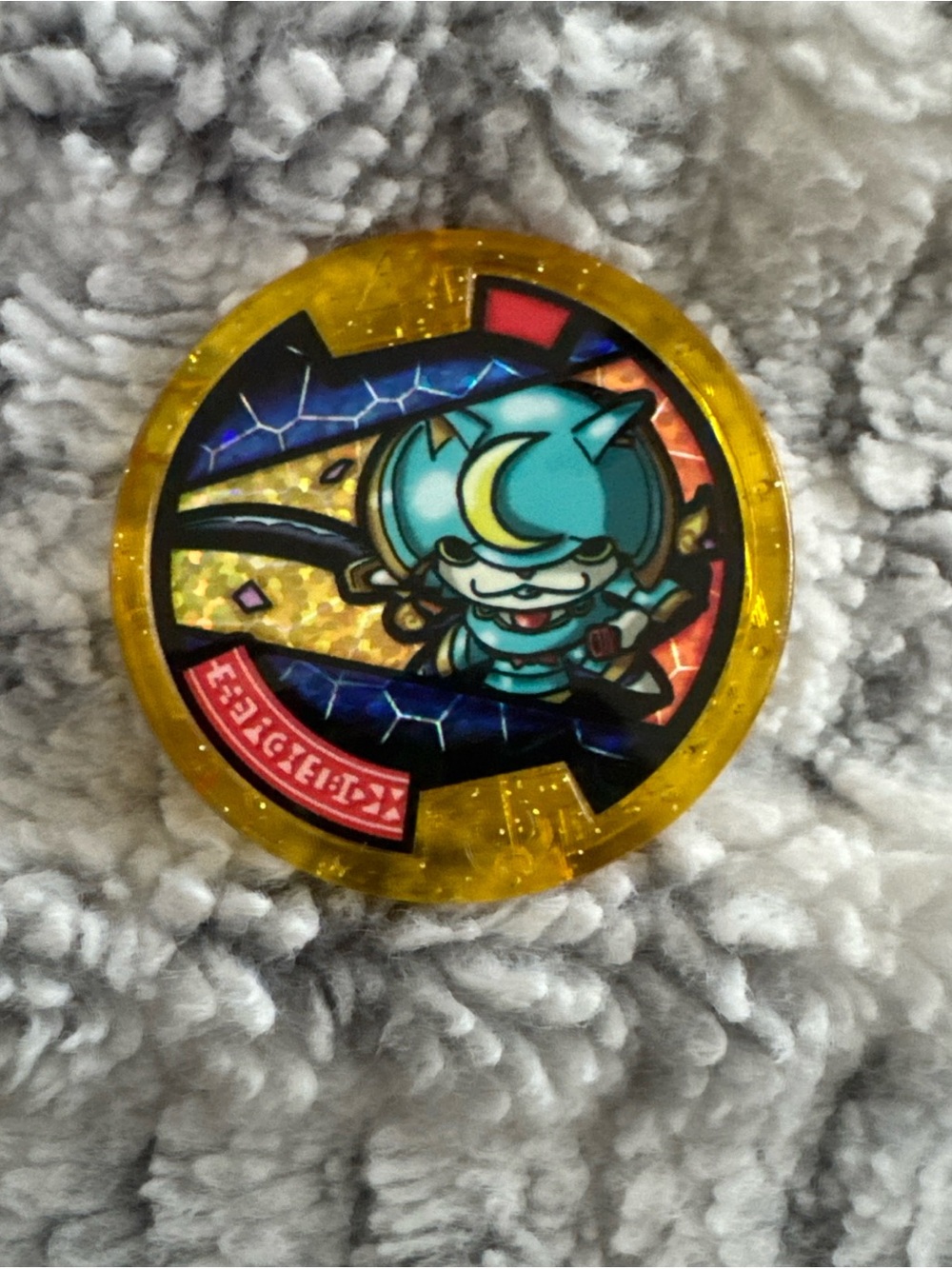Yellow Holographic Anime Game Medal with Teal Character